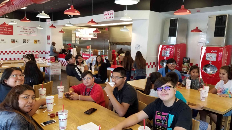 GRICUA youth eating at Five Guys