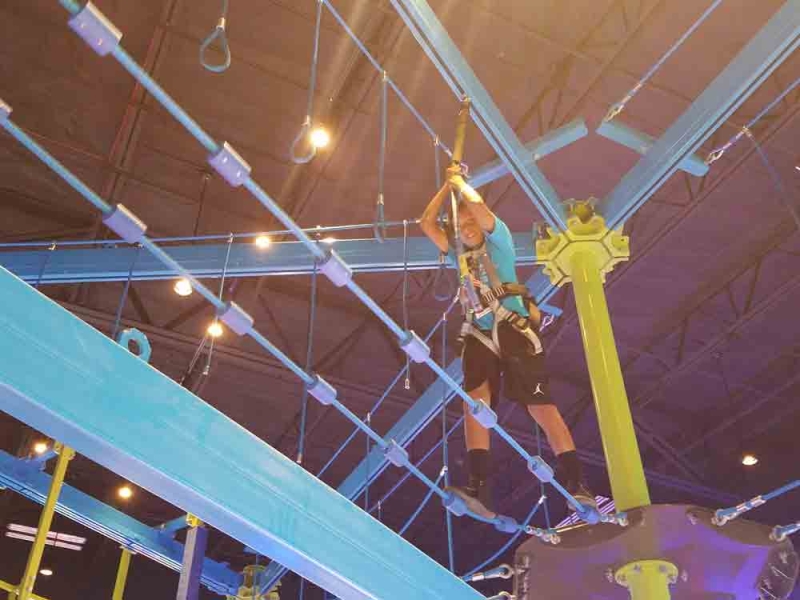 kid traversing ropes course